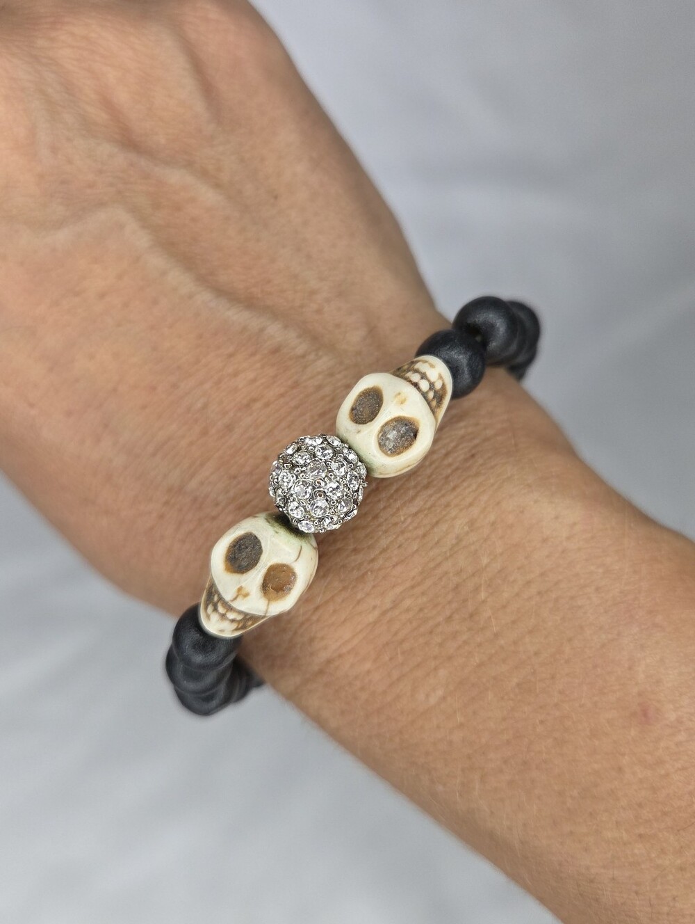 Crystal Accent Skull Bead Stretch Bracelet - Black and Ivory
